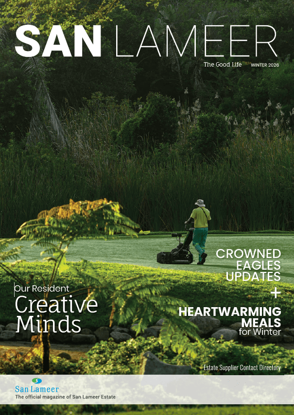 the Winter 2026 Cover of San Lameer the Good Life Magazine Featuring a Grounds Crew Member Tending the Lush Golf Course Fairway Surrounded by Dense Indigenous Vegetation and Ferns   San Lameer | South Africas Own Tropical Paradise